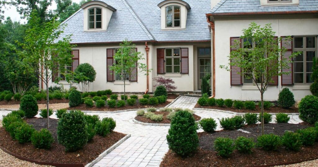 A beautiful front yard with bushes and shrubs.