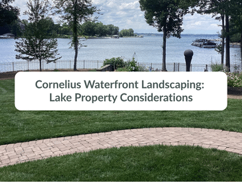 View of a landscaped lawn with a brick path overlooking a lake, trees, and boats, with text: "Cornelius Waterfront Landscaping: Lake Property Considerations.