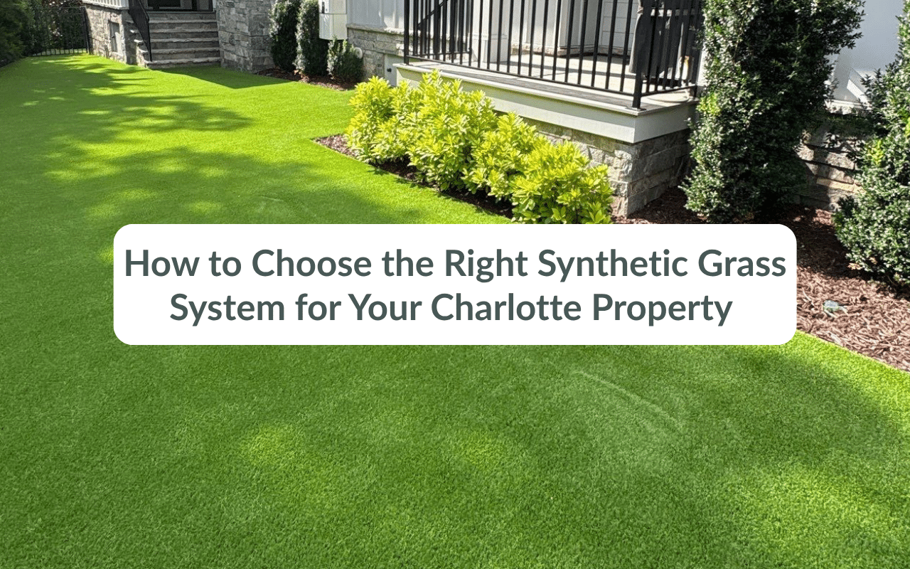 A yard with synthetic grass, bushes, and a house; overlay text reads "How to Choose the Right Synthetic Grass System for Your Charlotte Property.